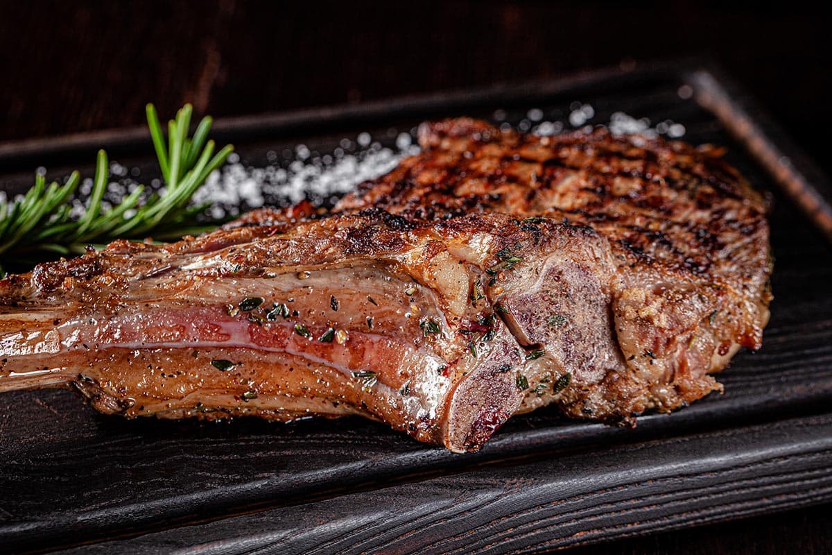 cooked piece of steak on a grill